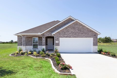 A house with a grey roof and a white garage door.