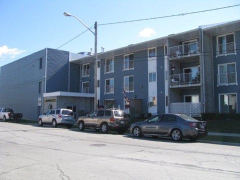 A car is parked in front of a building.