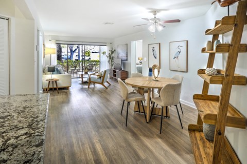 A dining room with a table and chairs is shown.
