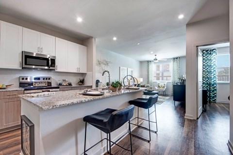A kitchen with a bar area and a dining area.