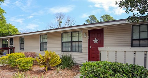 A house with a red door and a star on it.
