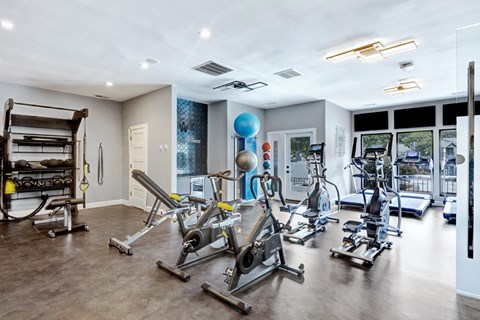A spacious gym with a variety of exercise equipment.