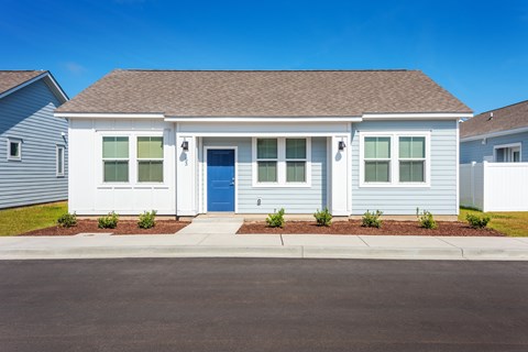 A small house with a blue door and windows.