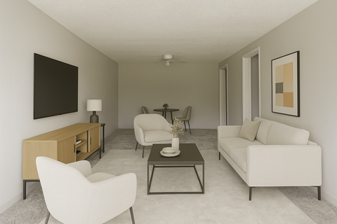 A living room with a white chair, a white couch, a coffee table, and a painting on the wall.