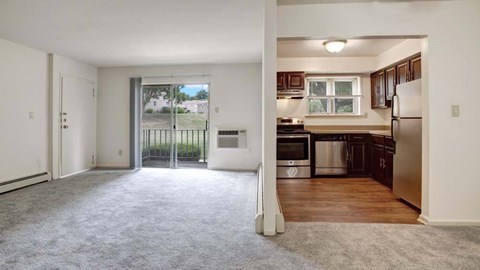 A spacious apartment with a kitchen and living room.