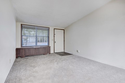 A room with a window and a door.