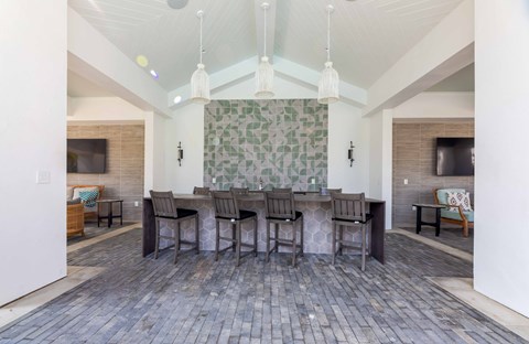 A dining room with a table and chairs.