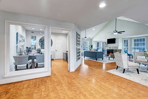 A living room with a television and a dining table.
