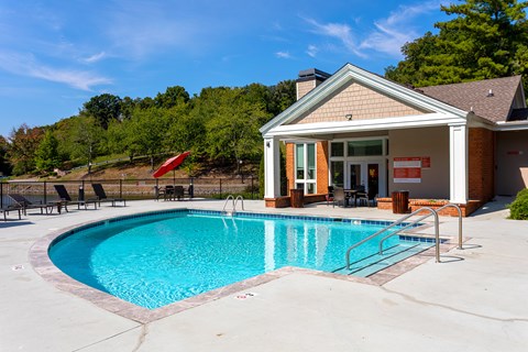 A pool with a building next to it.