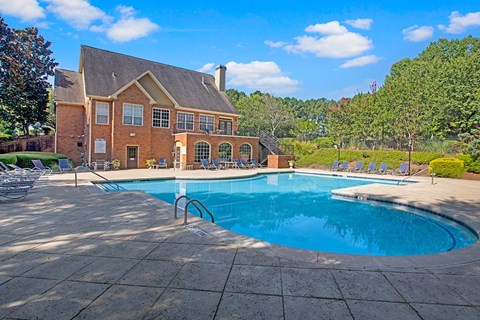 A large house with a pool in the backyard.
