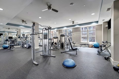 A spacious gym with a variety of exercise equipment.