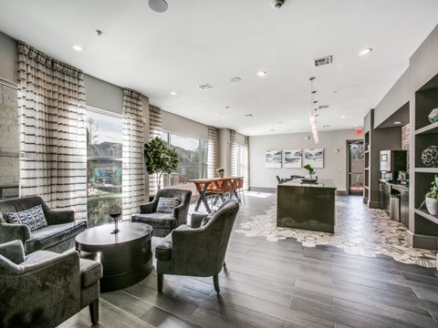 A living room with grey couches and a coffee table.