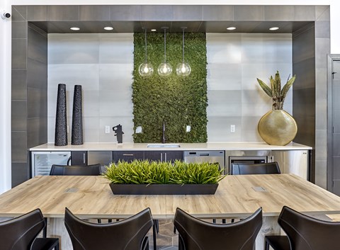 A modern dining room with a wooden table and chairs.