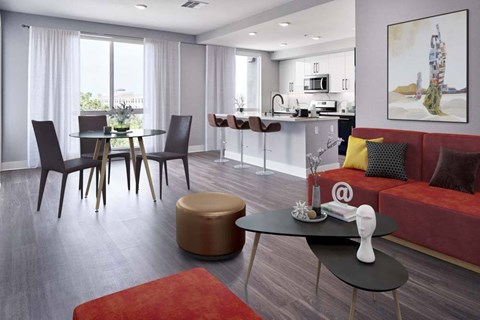 A modern living room with a dining table and chairs.