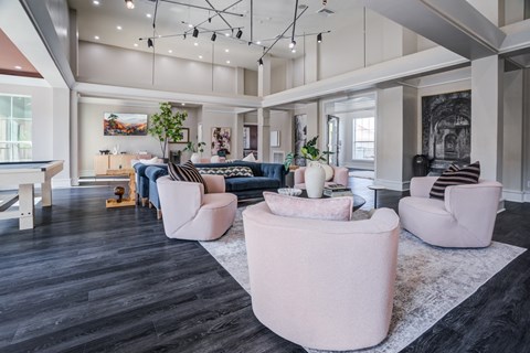 A living room with a black floor and white walls.