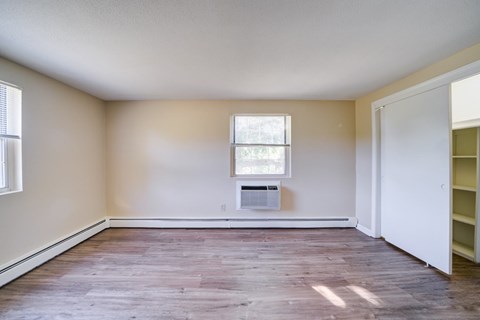 Empty room with a window and a door.