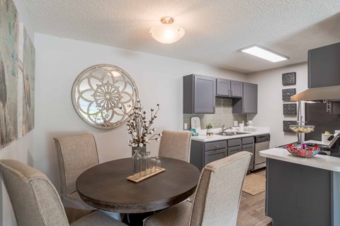 A kitchen with a stainless steel refrigerator and oven.