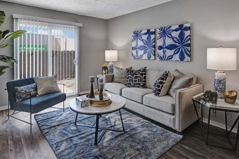 A living room with a blue and white color scheme.