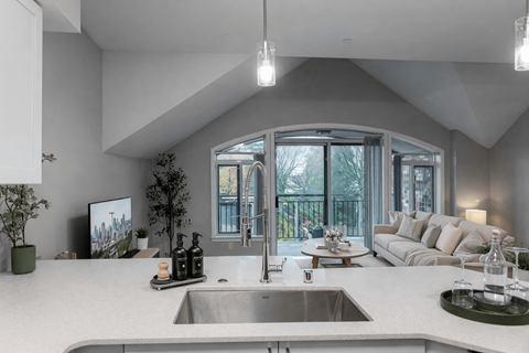 A modern kitchen with a large island and a sink.