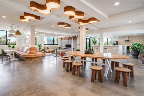 A modern dining area with a large table and chairs.