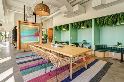 A conference room with a long table and chairs.