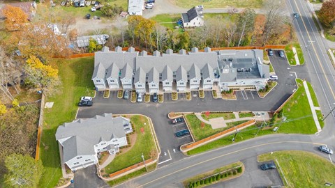 A large building with a parking lot in front of it.