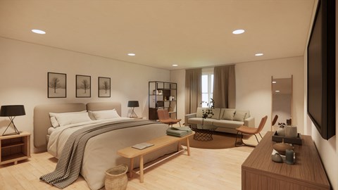 A modern bedroom with a large bed, a couch, a coffee table, and a TV.