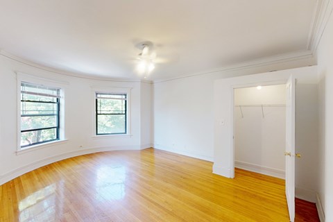 A room with wooden floors and white walls.
