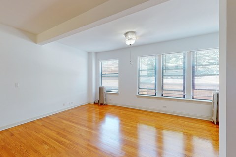 A room with wooden floors and white walls.