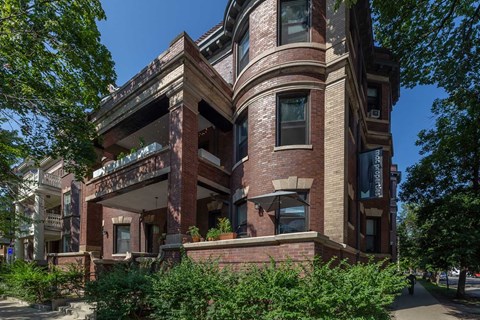 A large, old building with a balcony and a lot of windows.