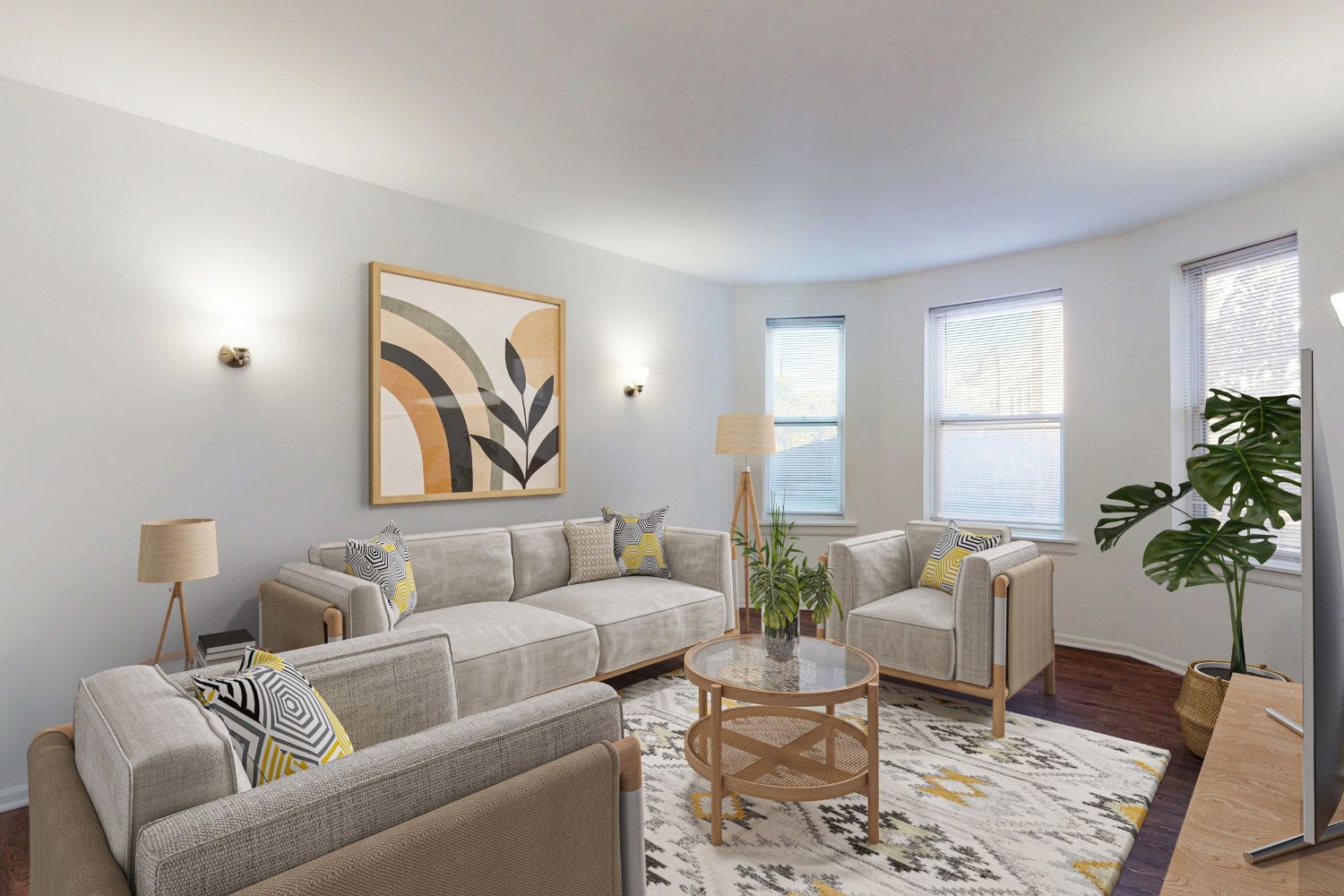 A living room with a grey couch, a coffee table, and a painting on the wall.
