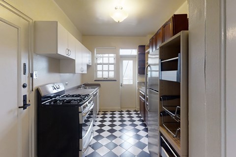 A black and white checkered floor in a kitchen.