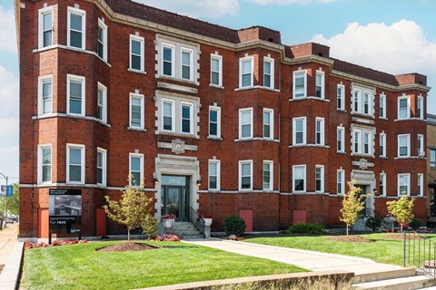 A red brick building with white trim and windows.
