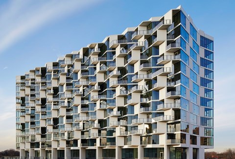 A modern building with a lot of windows and balconies.