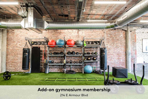 A gym with a membership sign on the wall.