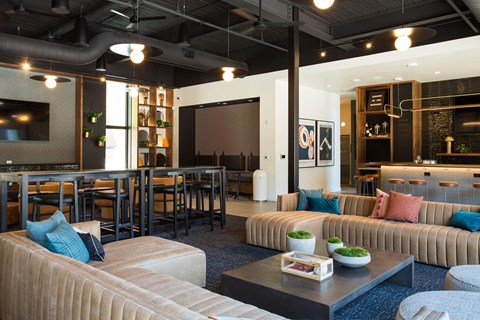 A modern living room with a large couch and a coffee table.