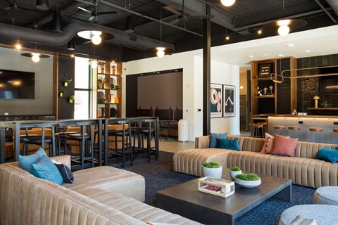 A modern living room with a large couch and a coffee table.