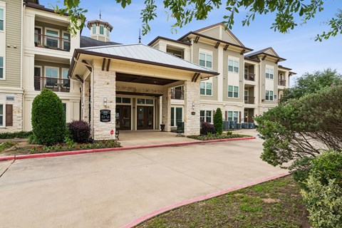 A large building with a covered walkway entrance.