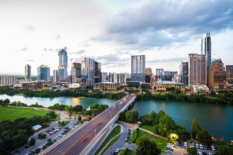 A cityscape with a river running through it.