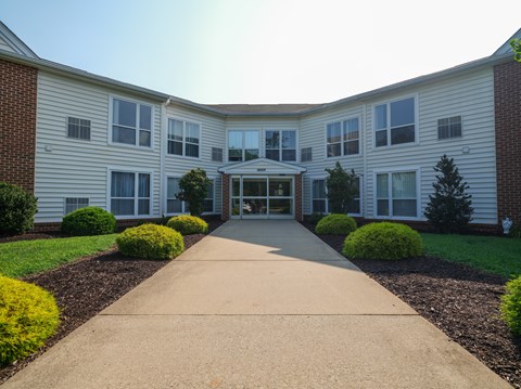 A building with a long walkway in front of it.