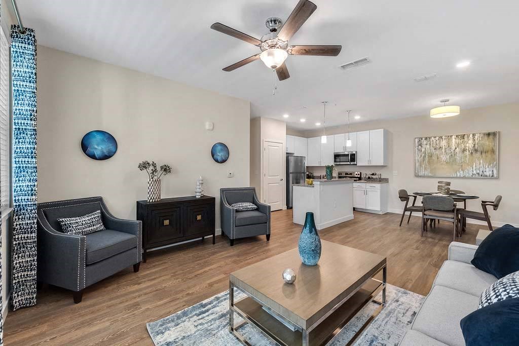 Living Room With Kitchen View at Waterline Bonita Springs, Bonita Springs, 34135