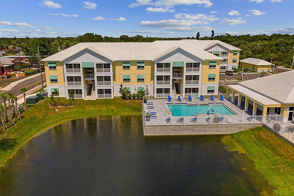 Aerial View Of Property With Lake at Waterline Bonita Springs, Florida