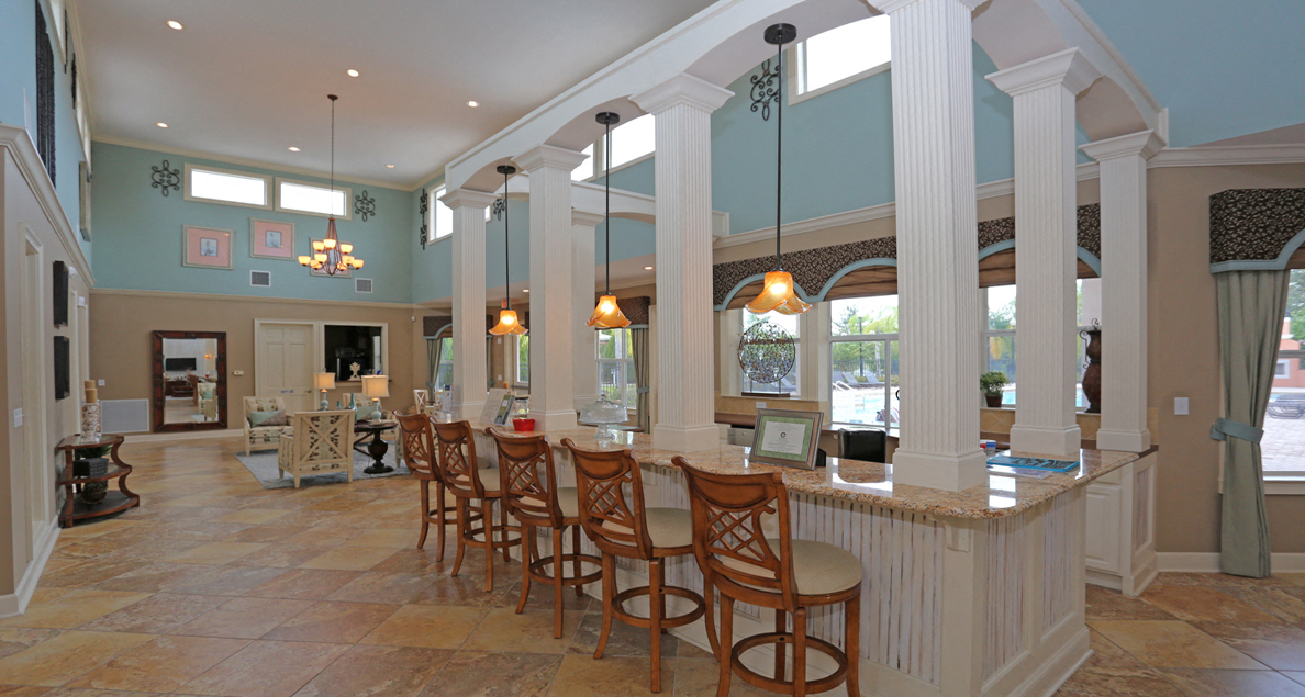 Elegant clubhouse with bar seating at The Columns at Bear Creek, New Port Richey, FL 34654
