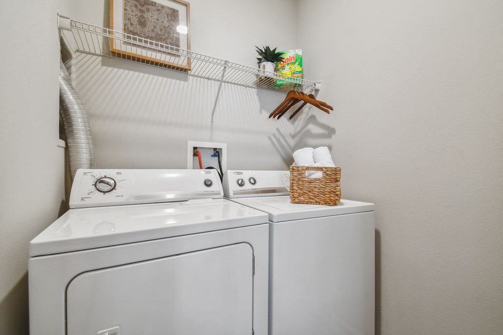 the washer and dryer in the laundry room of a home