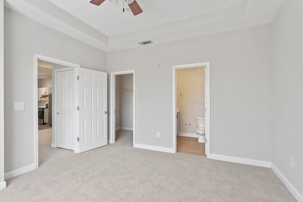 renovated bedroom and view of bathroom/closet