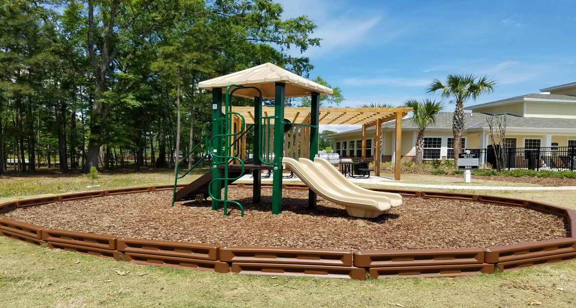 Park like playground with slides at The Columns at Coldbrook Station, Port Wentworth, Georgia