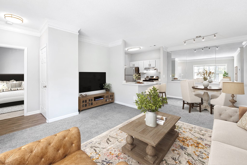 a living room with a couch a table and a chair