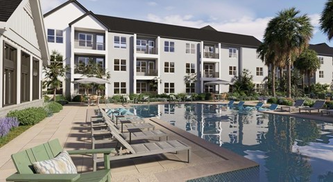 A large building with a pool in front of it.