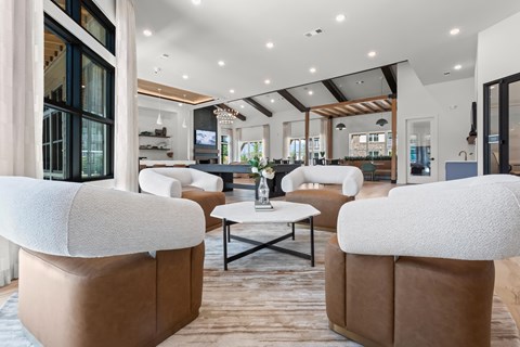 A modern living room with a brown sofa and a coffee table.