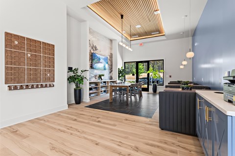 A room with a wooden floor and a calendar on the wall.